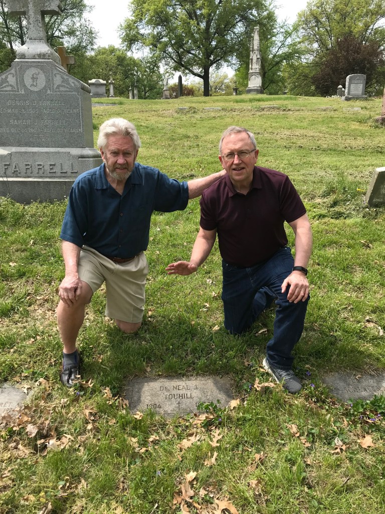 My brother Tom and I visiting my father's grave last year. 